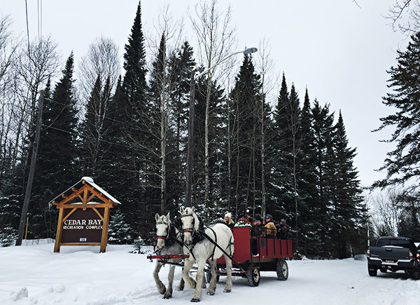 Cedar Bay sign and wagon ride