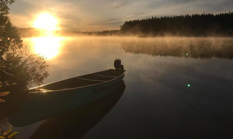 pond and canoe at Lower Twin Lakes Lodge