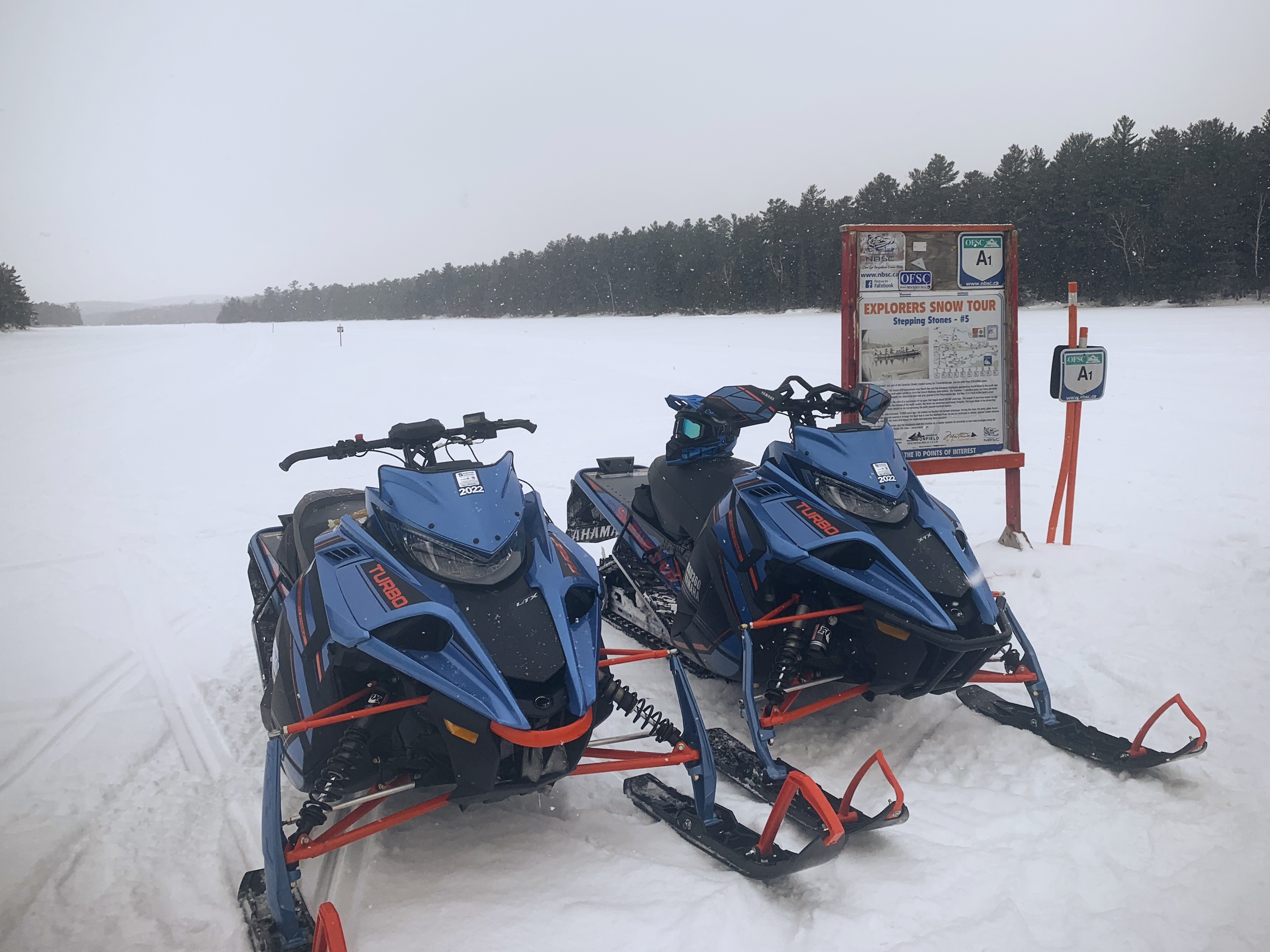 snowmobiles at stepping stones on explorers snow tour northeastern ontario