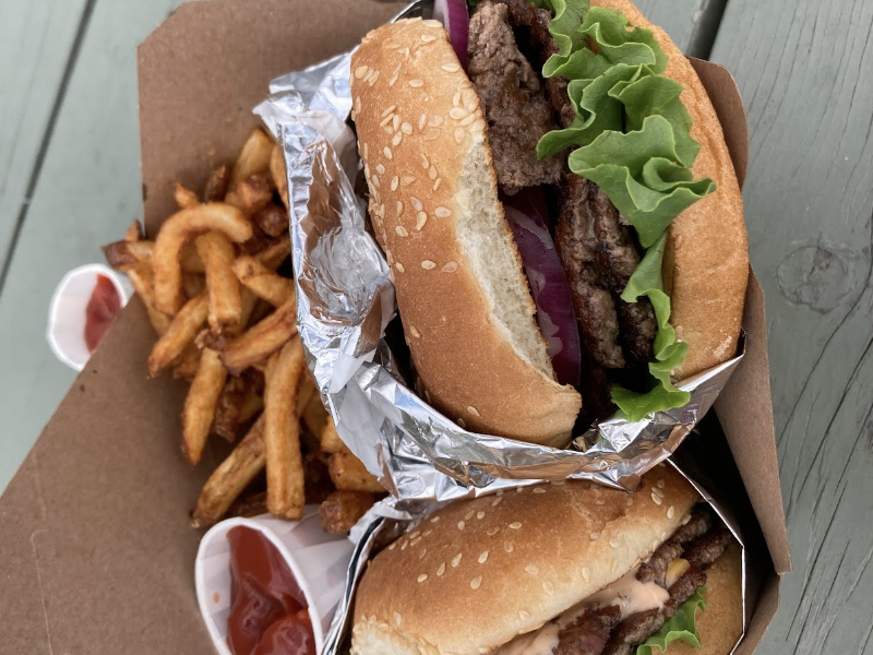 burger and fries in take out box