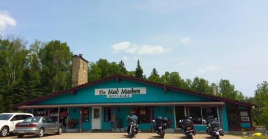 motorcycles parked outside of restaurant