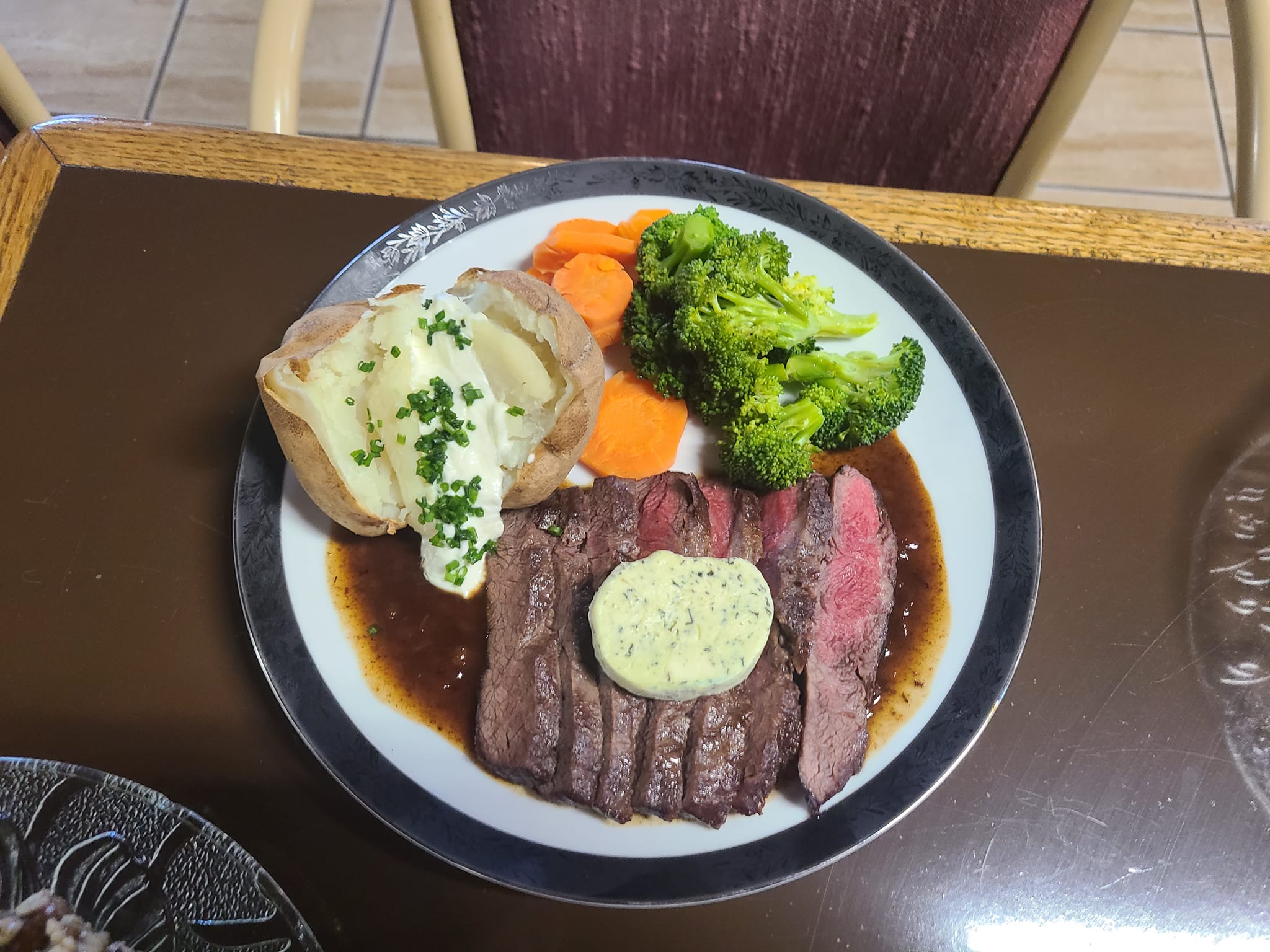 Steak, veggies and potatoes on plate