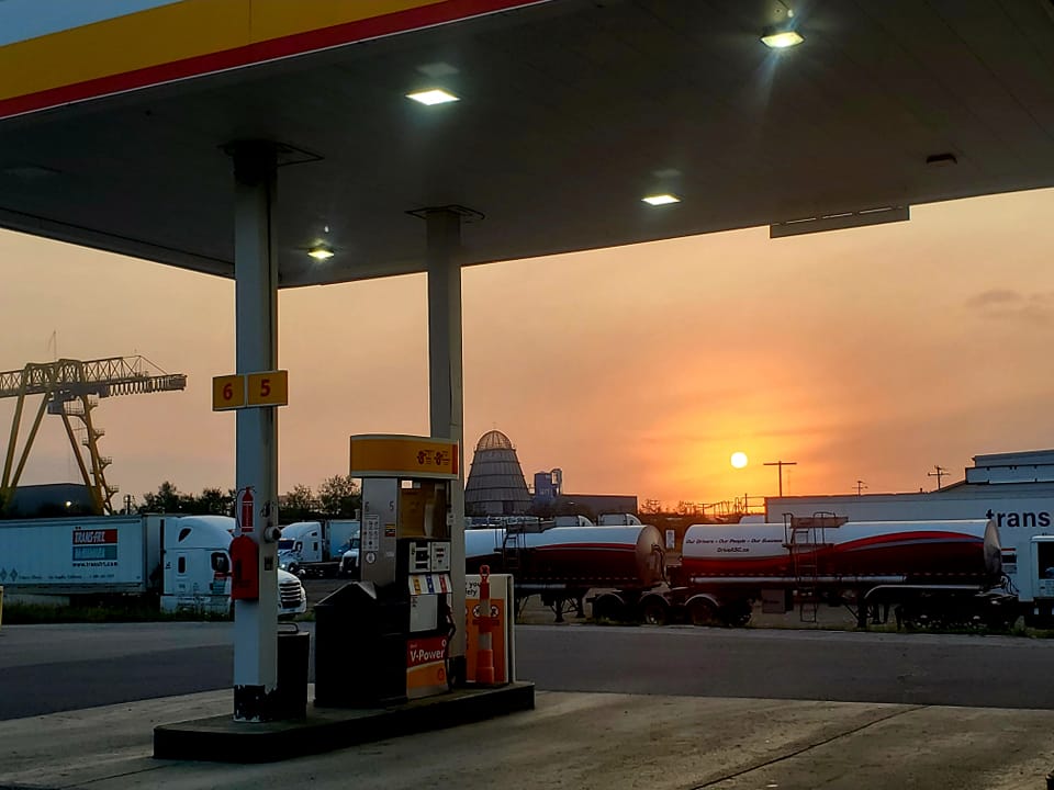 Gas pumps at sunset