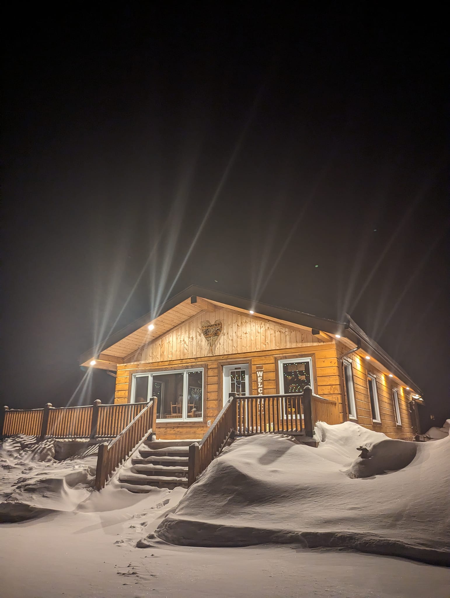 Cabin at night with snow