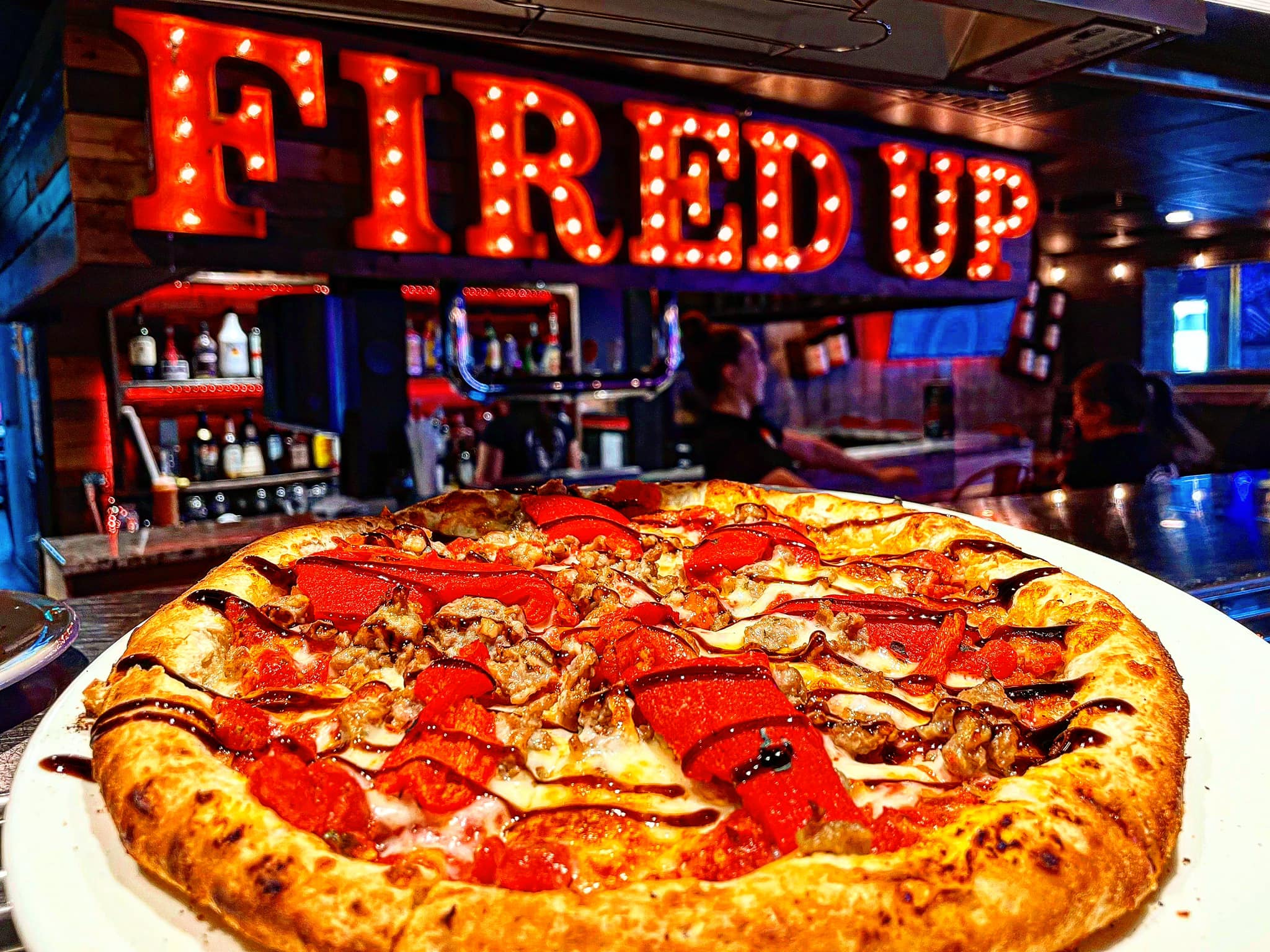 Pizza with neon sign