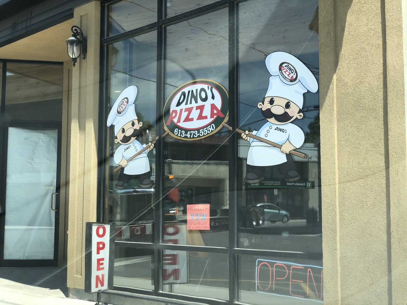 Two cartoon chefs holding up a logo that says "Dino's Pizza" on a glass window