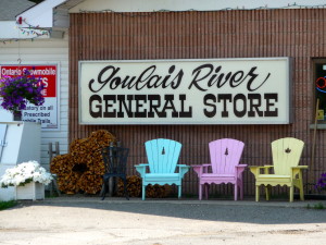 Chairs in front of store sign