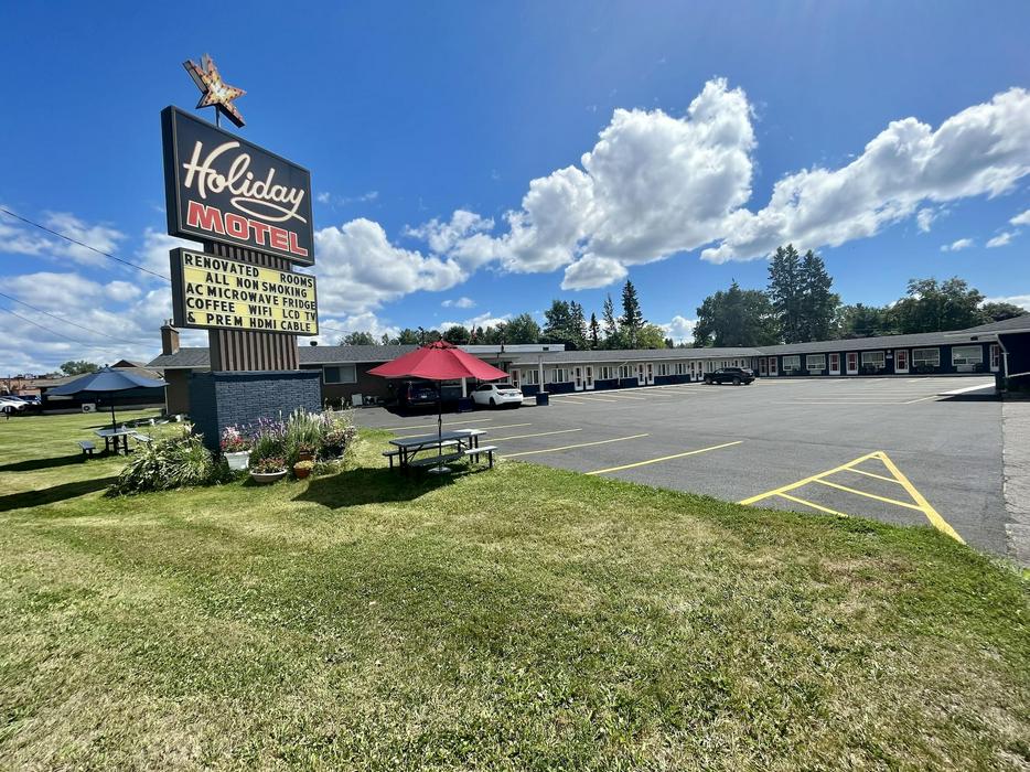 Exterior of motel with sign