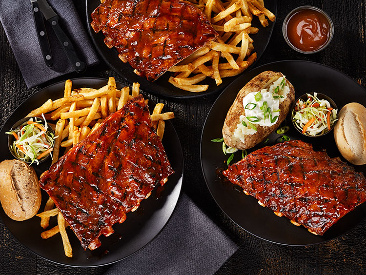 Ribs, baked potatoes and fries