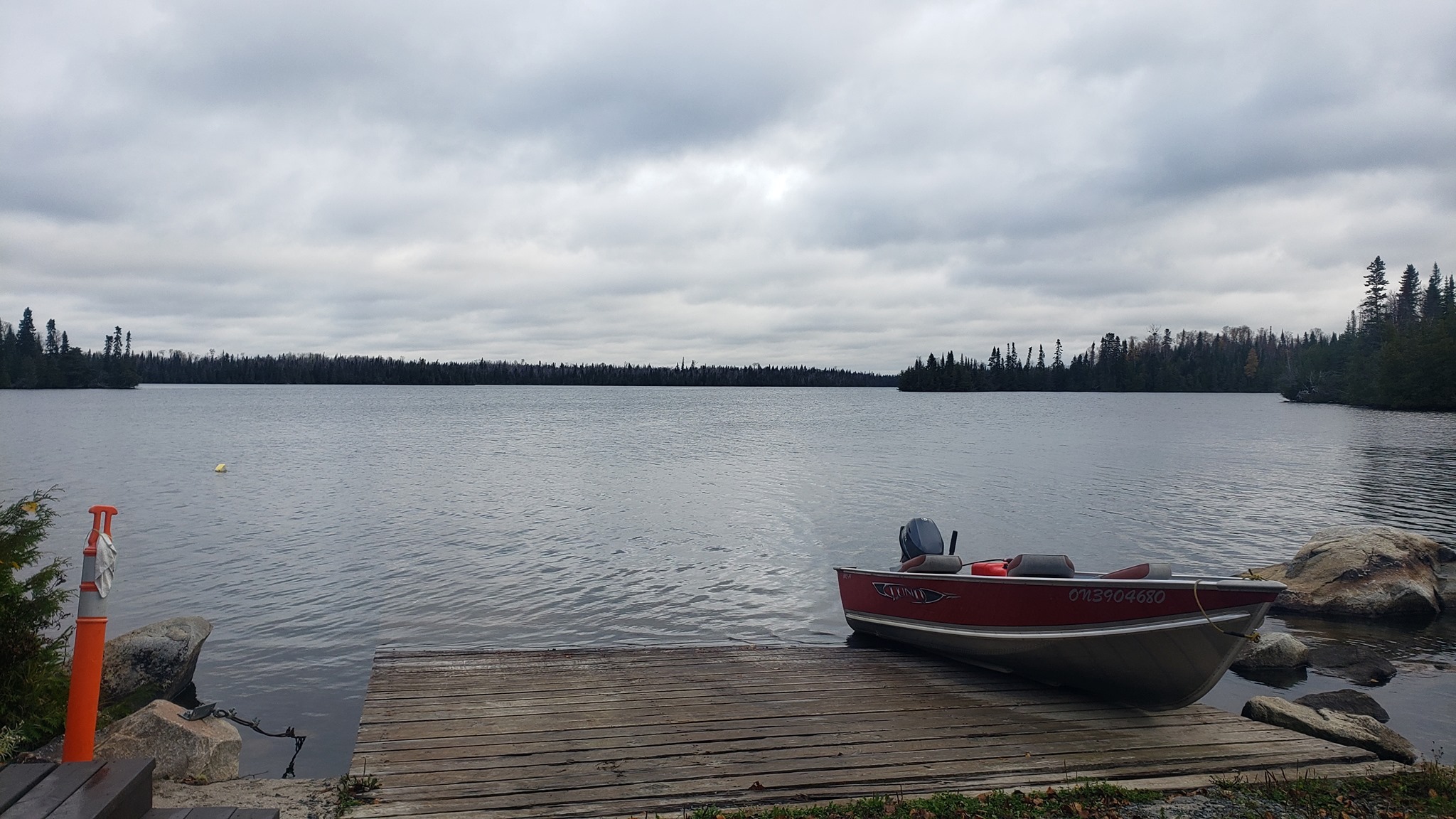 Boat on a boat ramp next to the lake