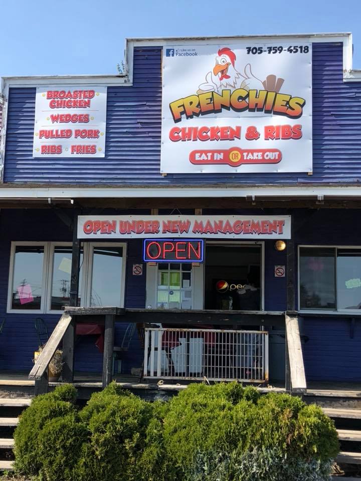 Exterior of restaurant with sign