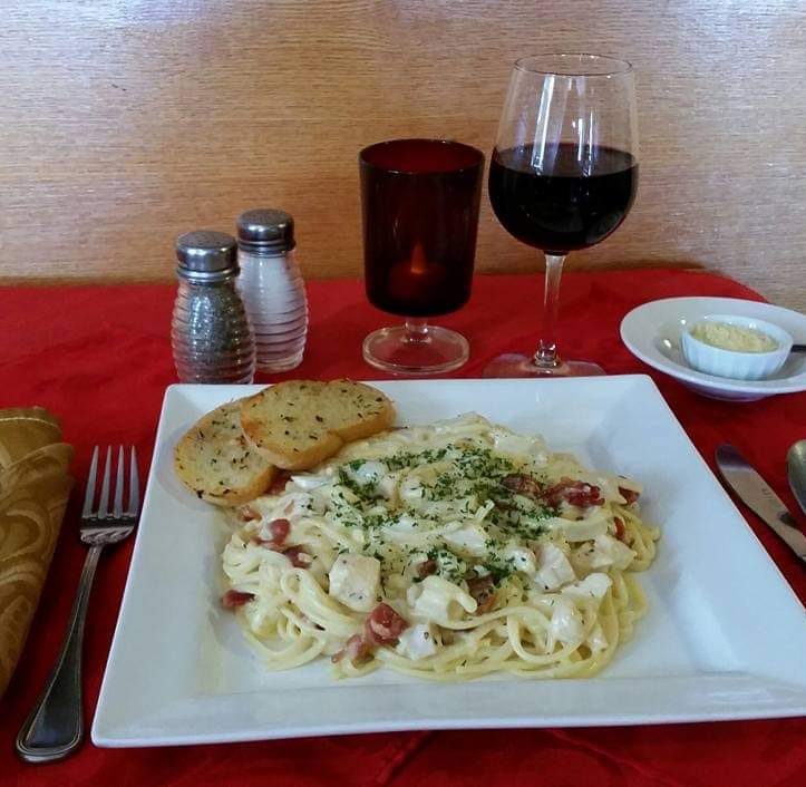 Pasta with bread and a glass of wine