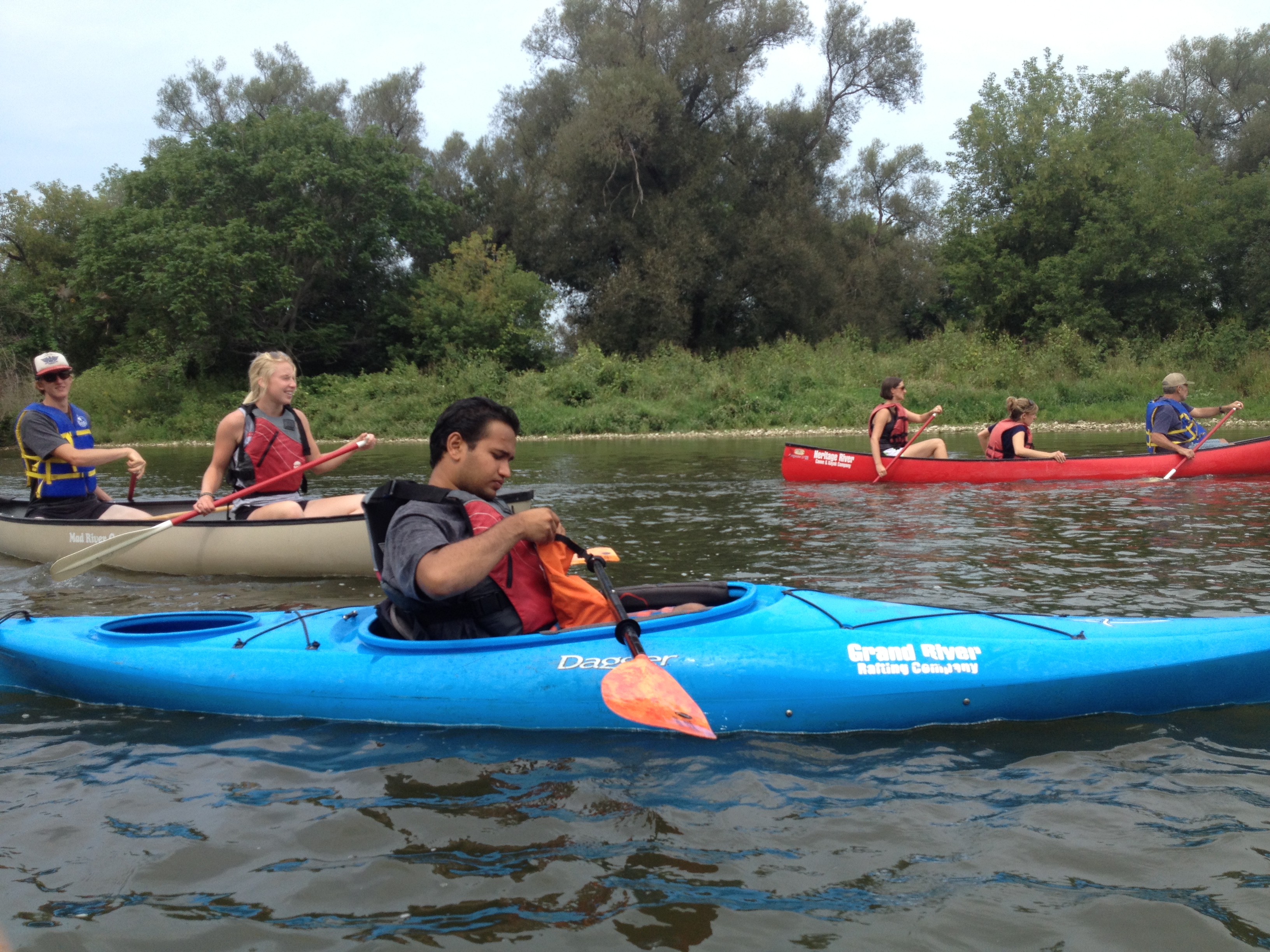 a person in a blue kayak in the water