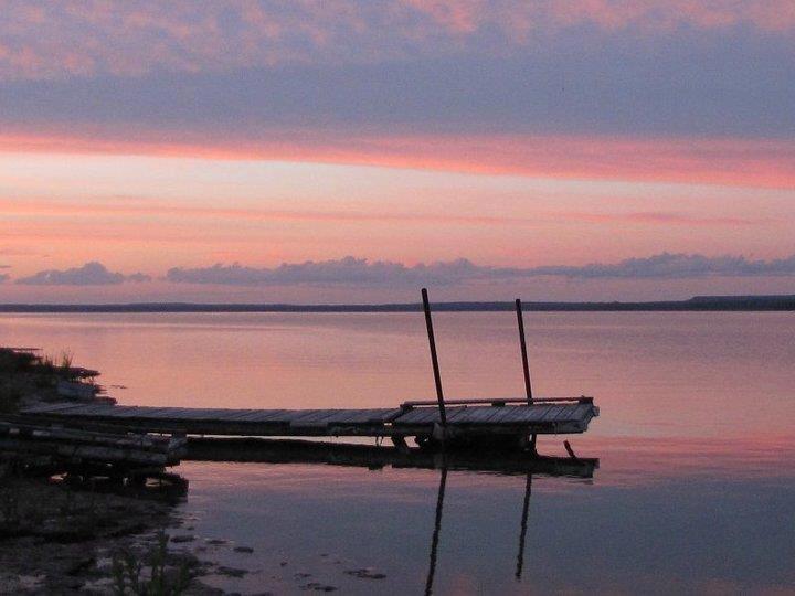 Dock on lake during dusk