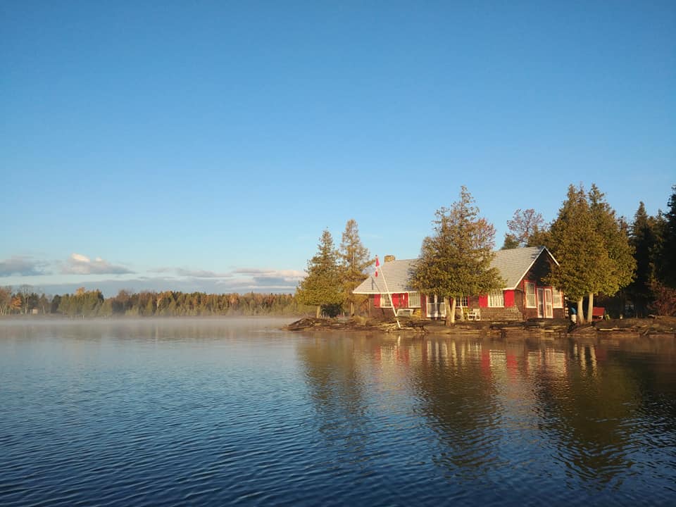 cabin on shore of lake