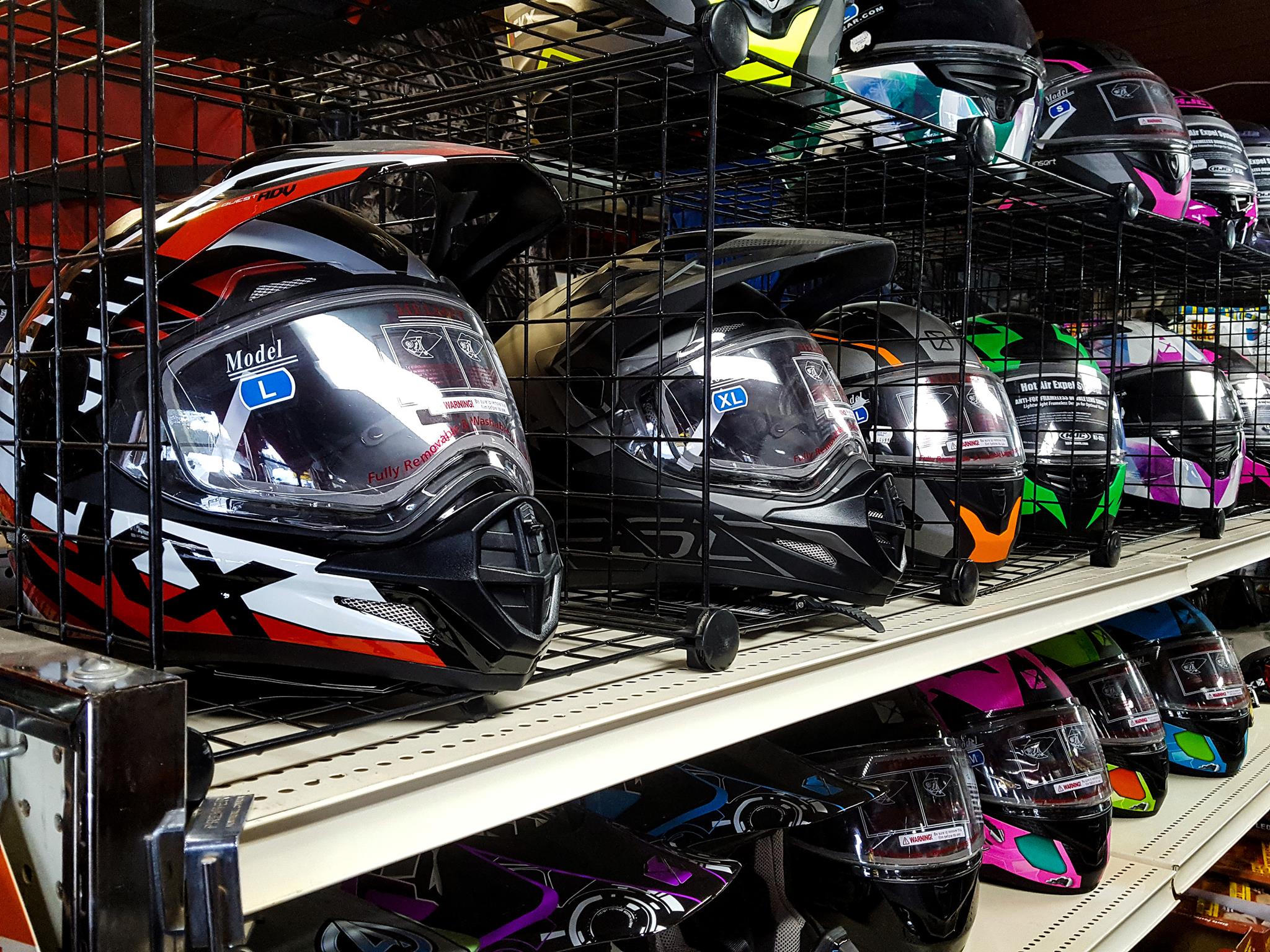 snowmobile helmets for sale on shelf