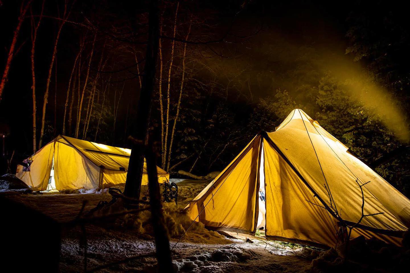 Tents lit up at night