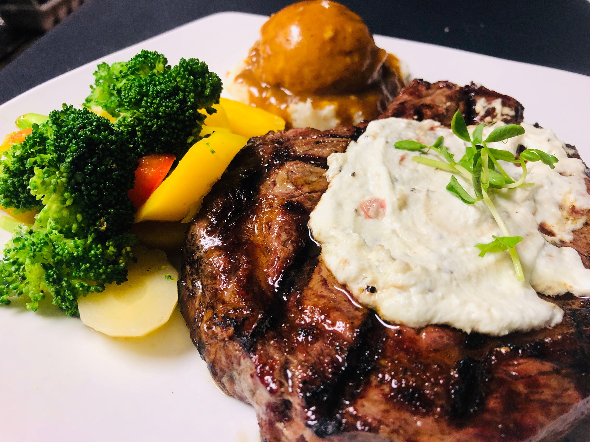 Steak, potatoes and vegetables