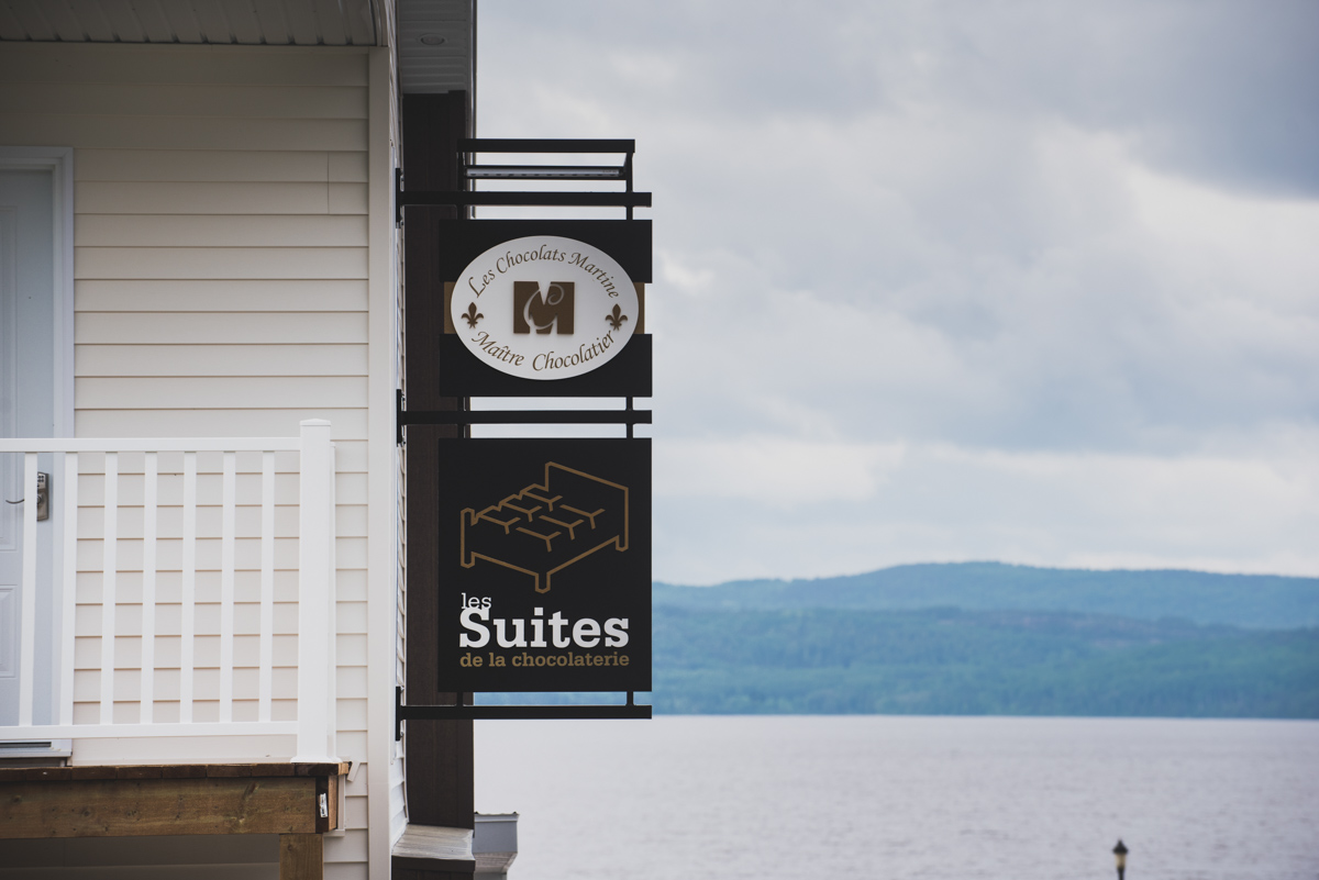 Chocolate and accommodation signs on building