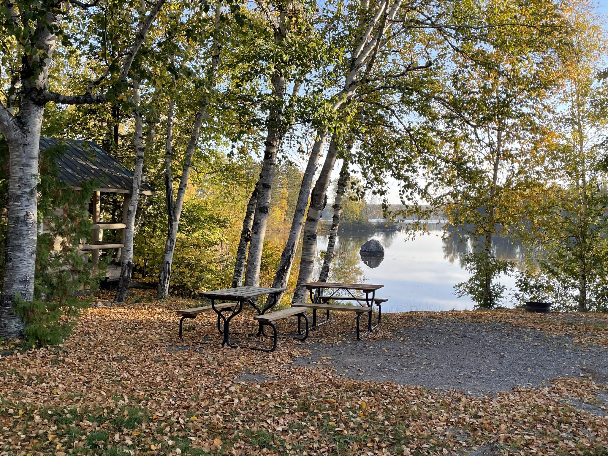 Campsite with tables along lake