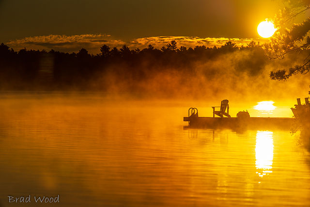 Dock on lake at sunrise