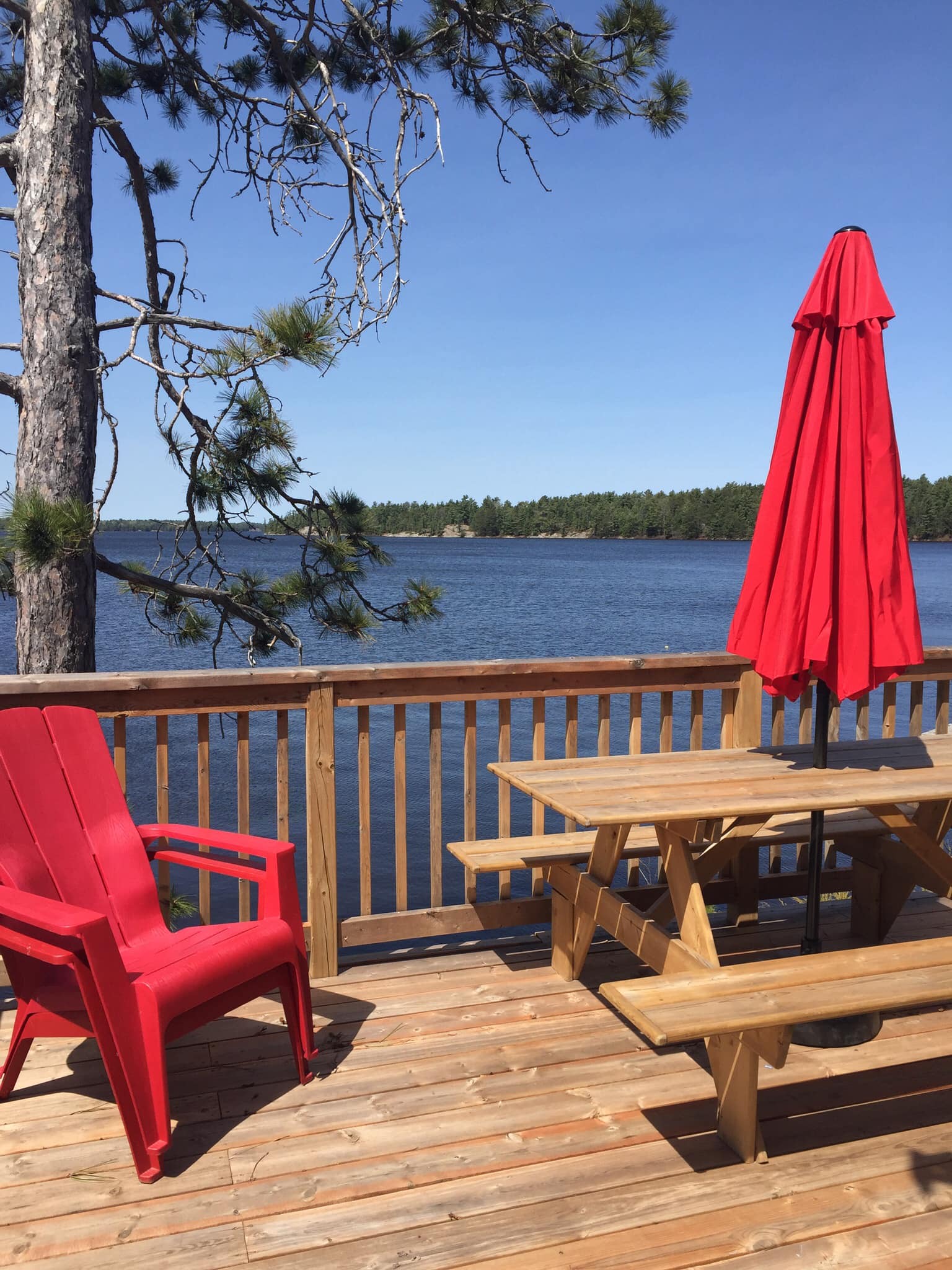 Patio with chairs looking over lake