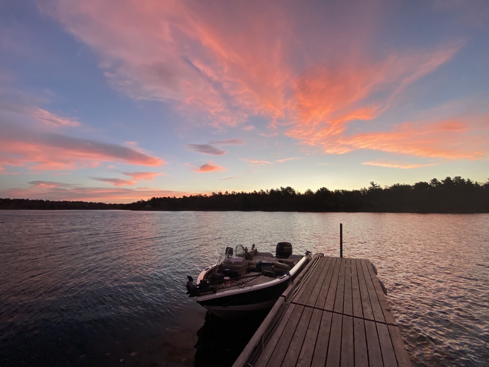 Boat and dock at sunset