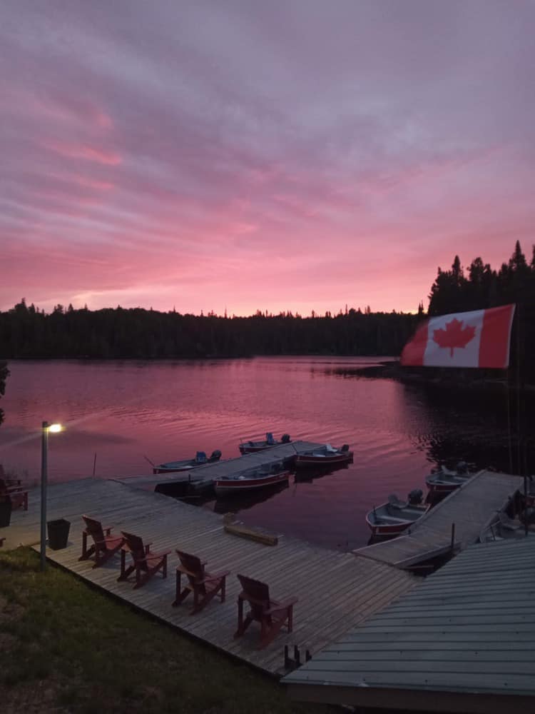 Dock on lake at sunset