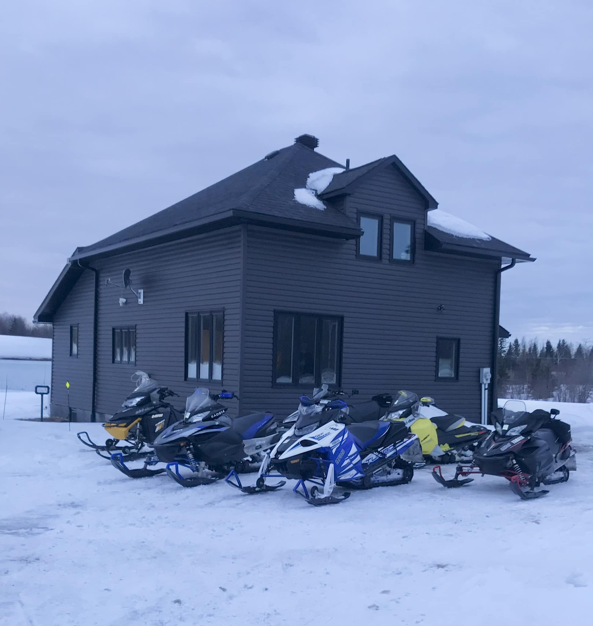 House with snowmobiles