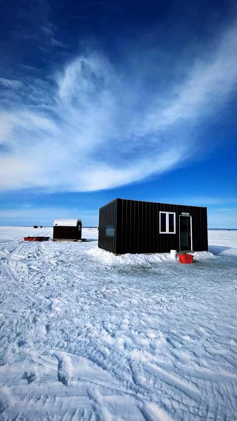 Ice hut on lake