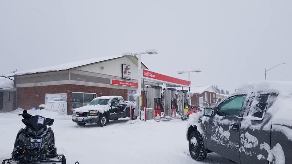 Gas station with snowmobile