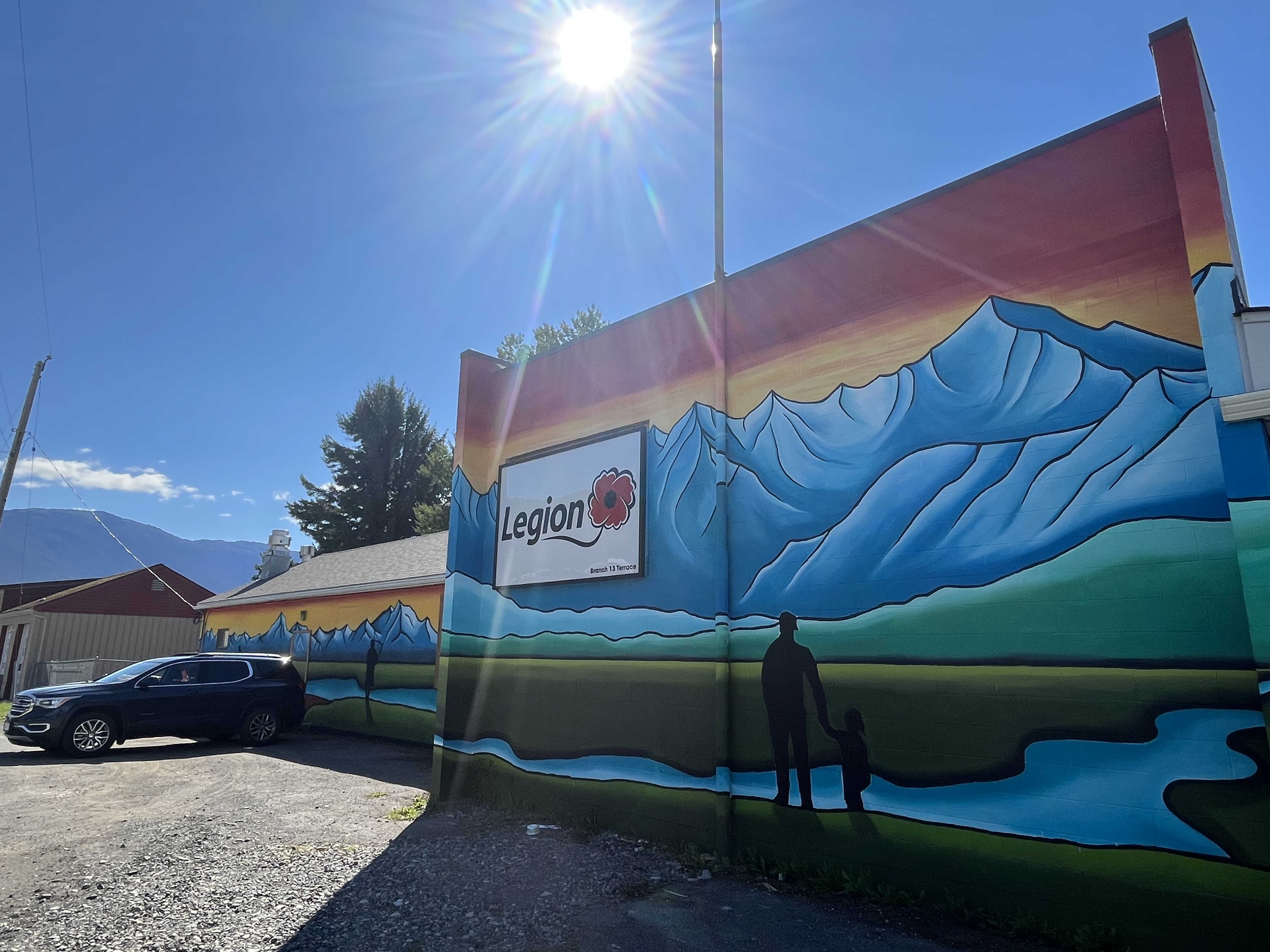 a colourful mural of mountains on the side of a building