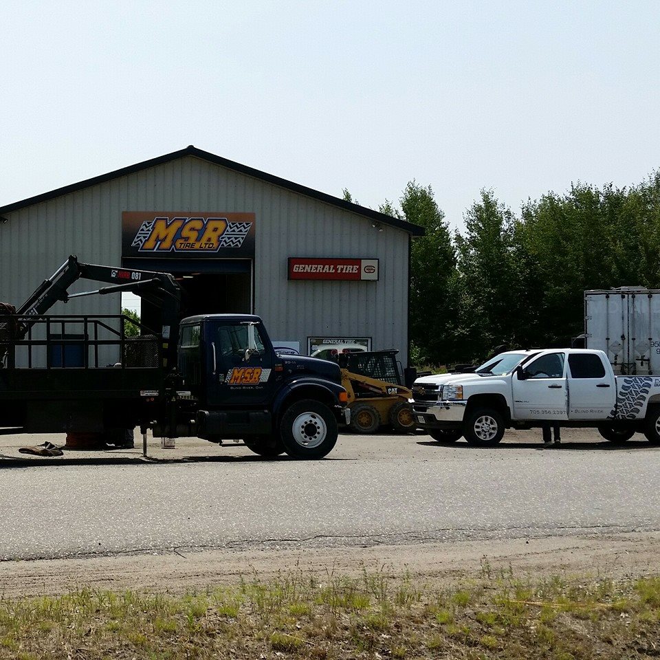 Exterior of building with tow truck 