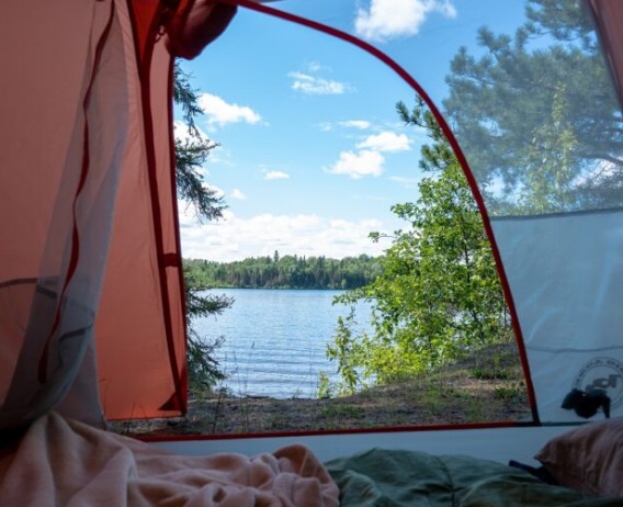 Inside of tent looking out at lake