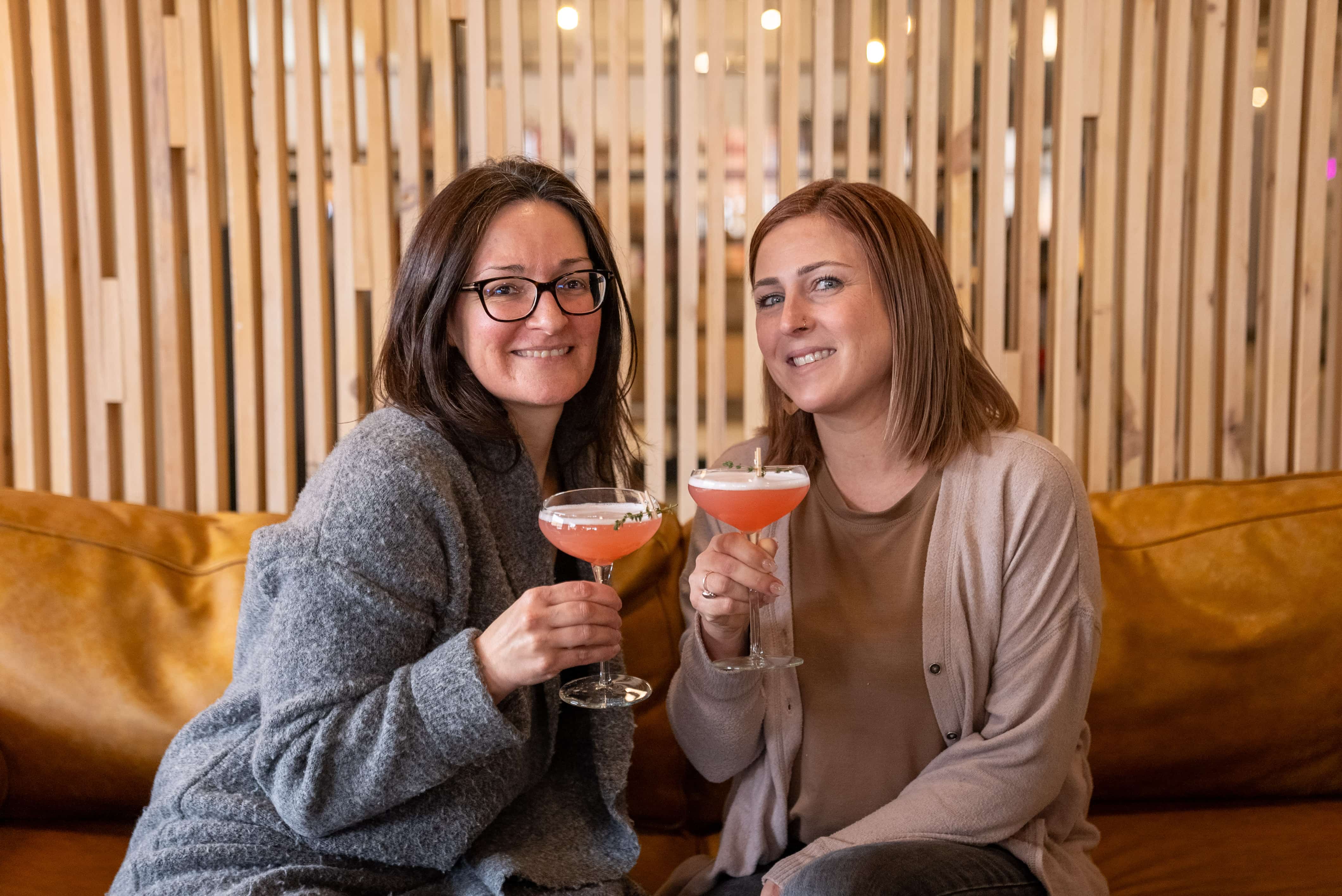 Happy sippers at Woodside Bar in Goods and Co Thunder Bay Ontario Canada