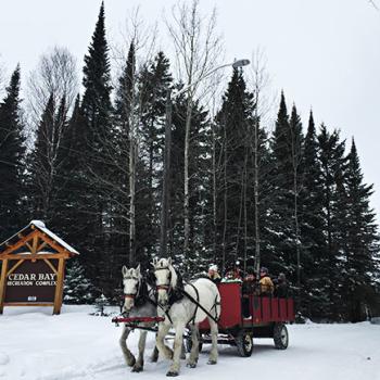 Cedar Bay sign and wagon ride