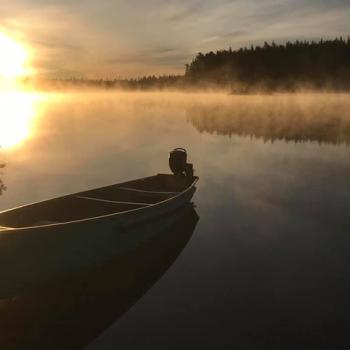 pond and canoe at Lower Twin Lakes Lodge