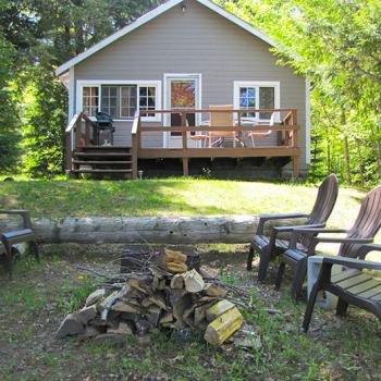 Housekeeping Cottage with fire pit and chairs