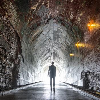 Sillouette walking down Tunnel at Niagara Parks Power Station