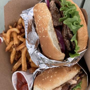 burger and fries in take out box