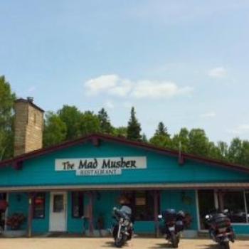 motorcycles parked outside of restaurant