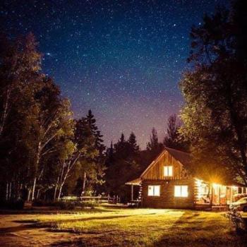 Cabin in woods at night