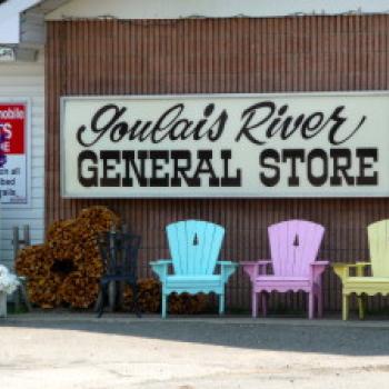 Chairs in front of store sign