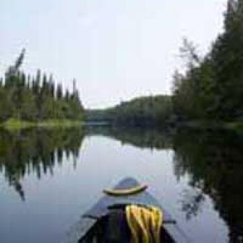 Kayak floating down a river