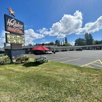 Exterior of motel with sign