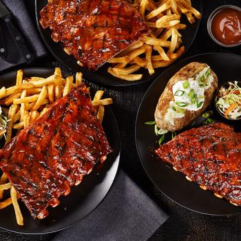 Ribs, baked potatoes and fries