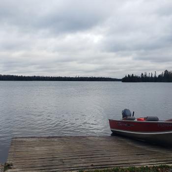 Boat on a boat ramp next to the lake