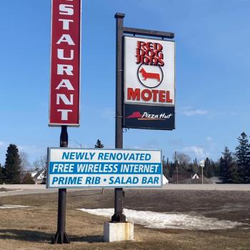 Outdoor signs for the Red Dog Inn