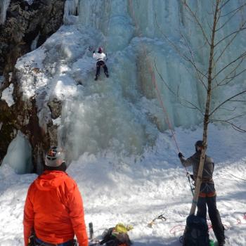 People ice climbing