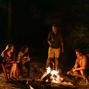 People sitting around the fire